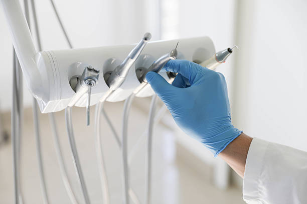 Professional Root Canal Treatment technician working in Harnett County County, NC